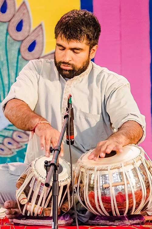 Devesh Chandra playing a tabla.