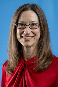 Headshot of Dr. Rogers wearing a red shirt. 