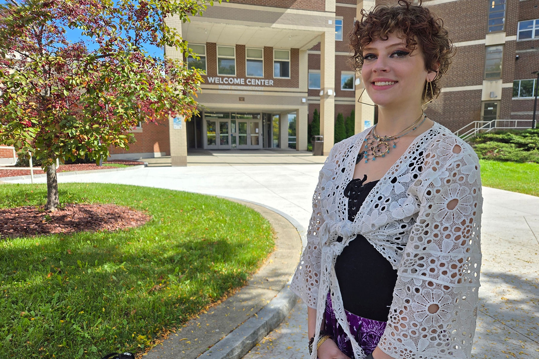 Chloe Connors standing outside in The Quad, smiling