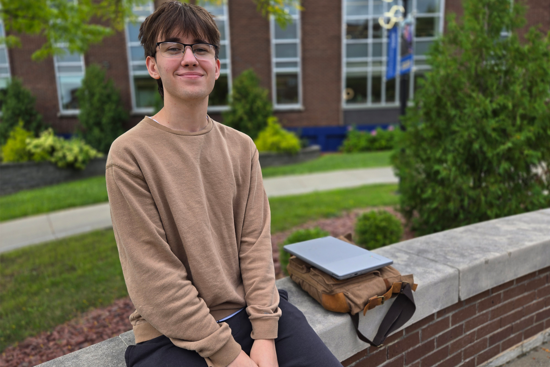 Jullien Kokaly sitting outside in The Quad
