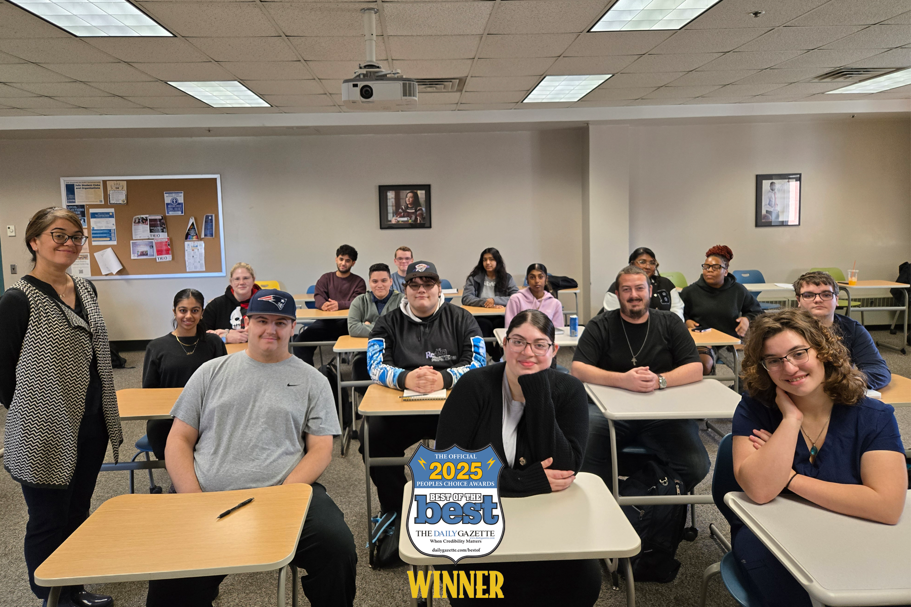 Dr. Lorena Harris and students sitting in class, smiling