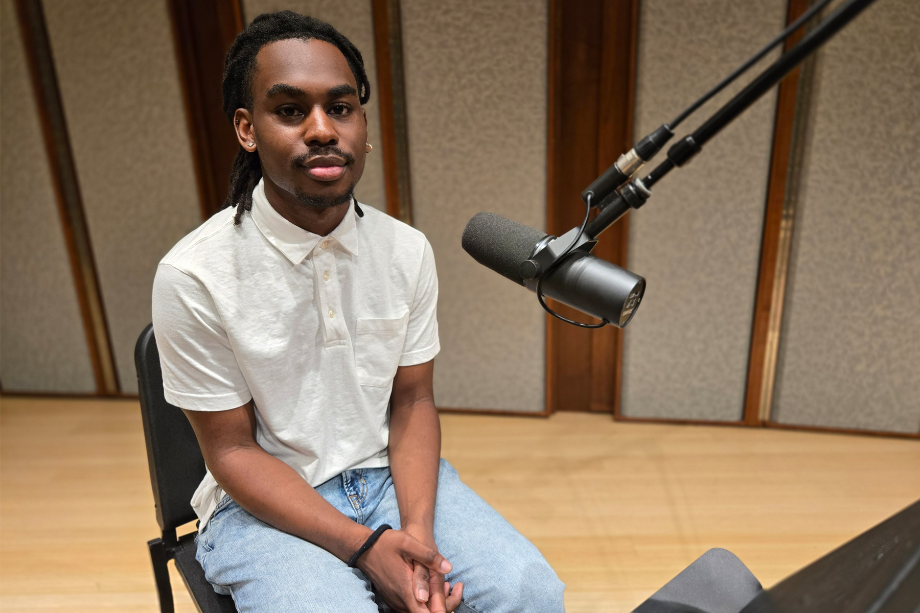 Warren Baynes, sitting in front of microphone in recording studio