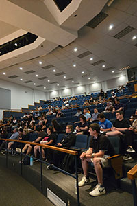 Students and families sitting in Carl B. Taylor Auditorium.