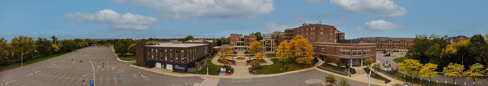 Panoramic image of campus, taken from the parking lot, facing the Quad.