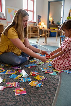 Teacher Education student working with a child in the Integrated Preschool Laboratory.