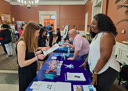 Students talking to recruiters at a career fair.