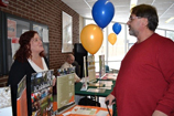 Student talking to a business person at an on-campus career fair.