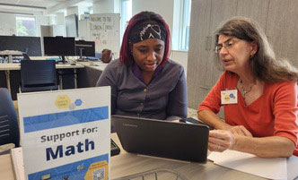 Student working one-to-one with a math tutor.