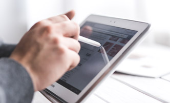 Person working on a tablet.