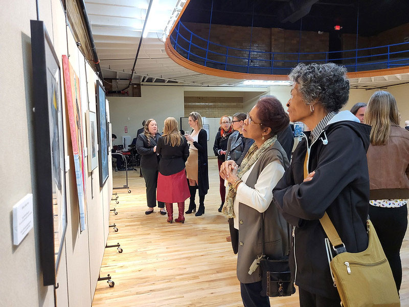 Guests viewing the artwork at the opening of the Rise Gallery.