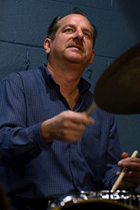 Bob Halek playing a drum kit. 