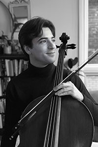 Michael Kirsty holding his cello.