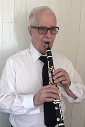 Tom Gerbino playing a clarinet.