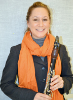 Michele Von Haugg holding her clarinet.