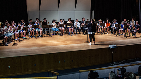 Trumpet students on stage in the auditorium.
