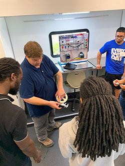Students and instructor inside the manufacturing mobile lab. 