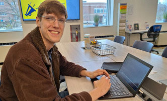 Student working on a laptop in the Learning Commons.