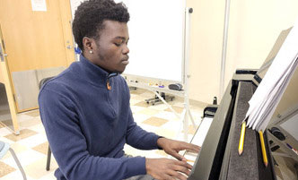 Man playing a piano.