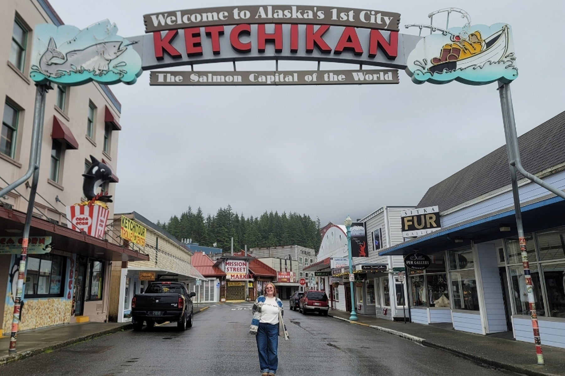 Ally Becker standing under Ketchikan sign outside
