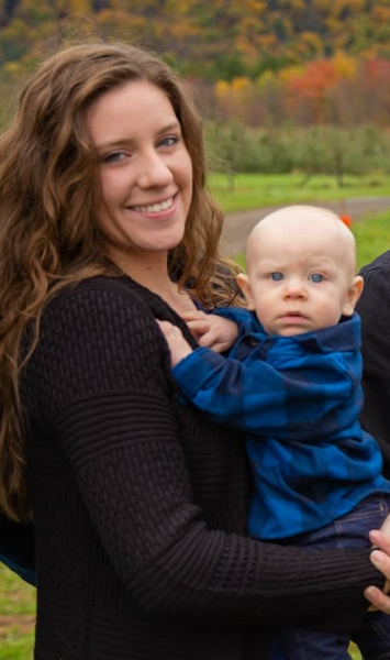 Amber Dorvee outside with her infant son