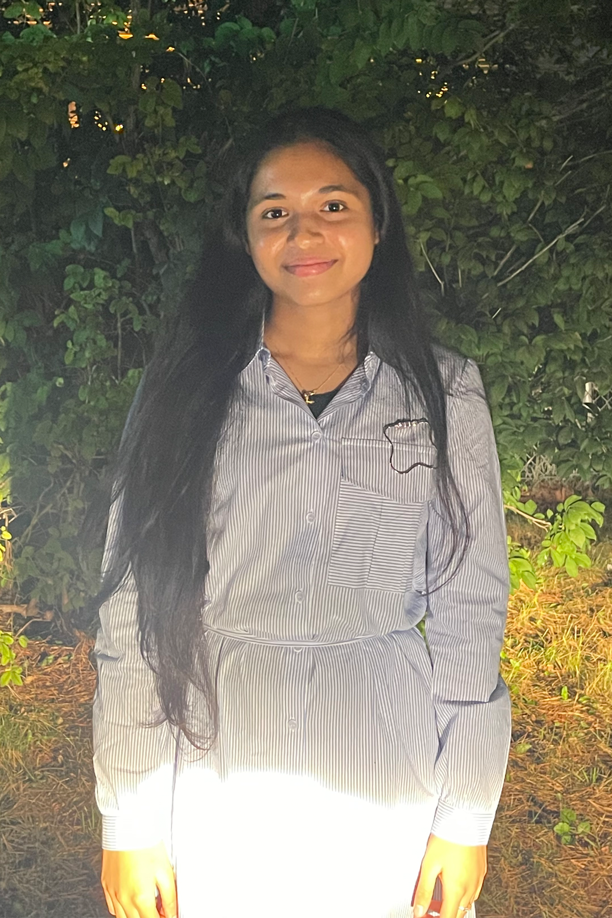 Ariana Bhola standing outside, smiling