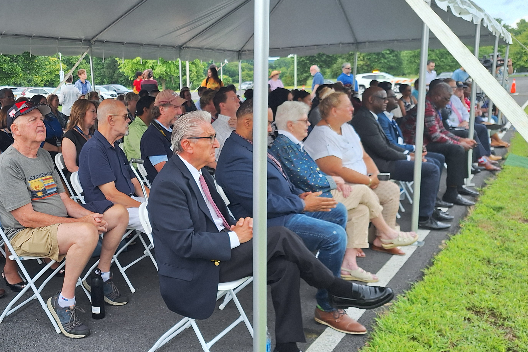 Crowd seated listening to speakers during event