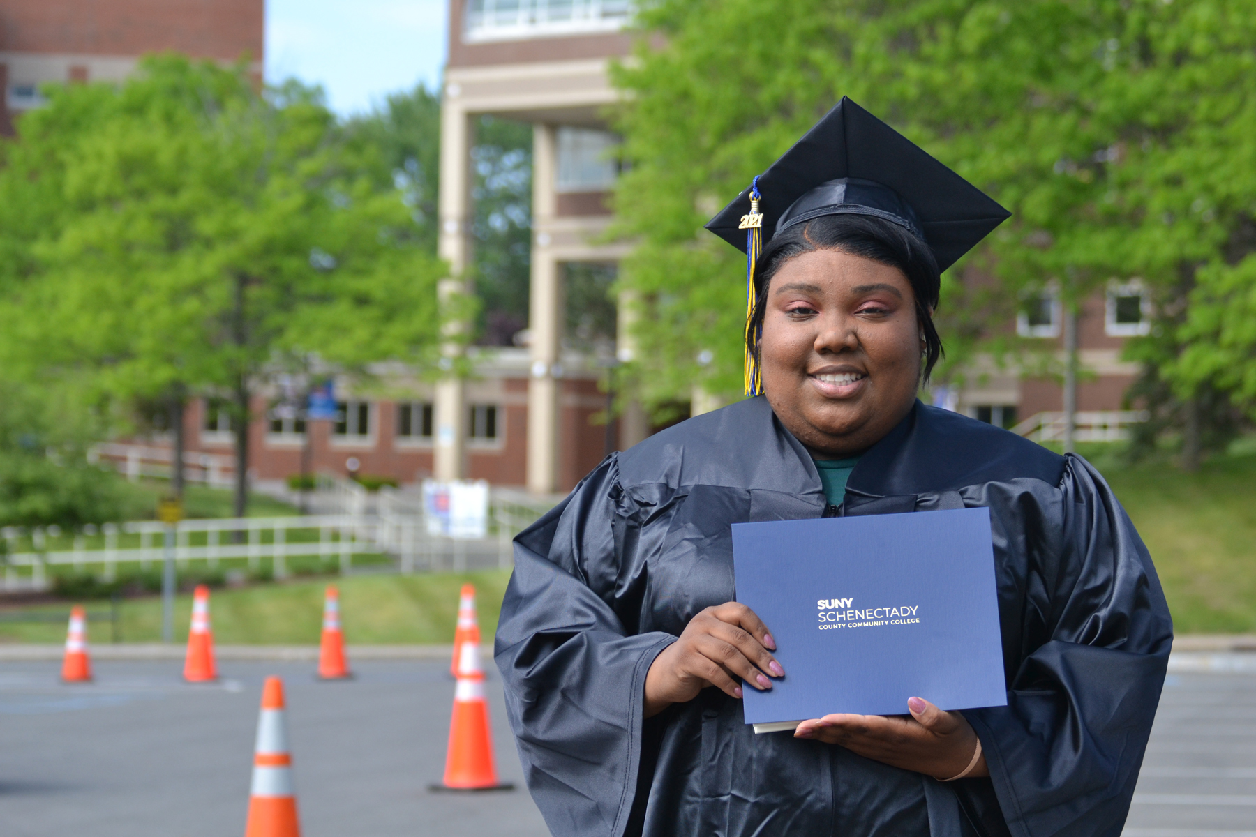 Bovanna Phillips holding her degree