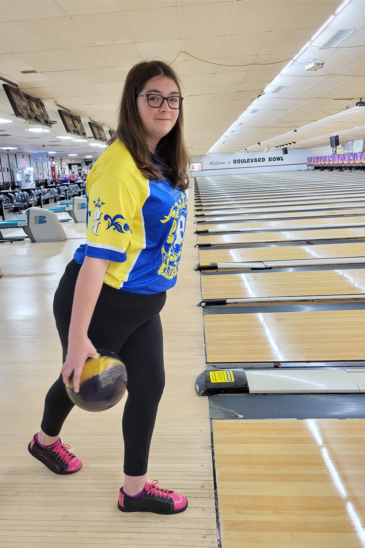 Kaitlyn Rose bowling, smiling at camera