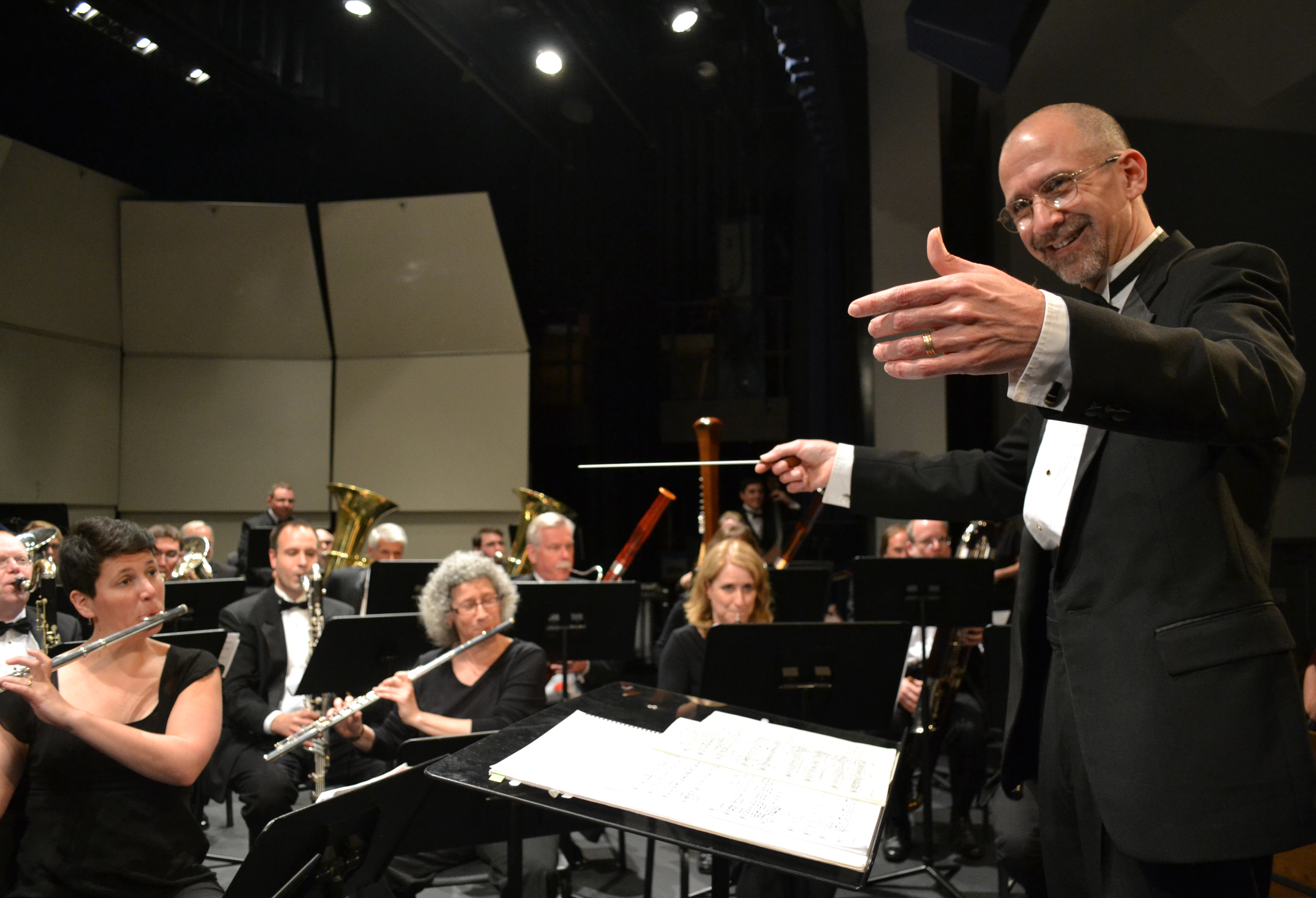 Brett Wery on stage directing Capital Region Wind Ensemble