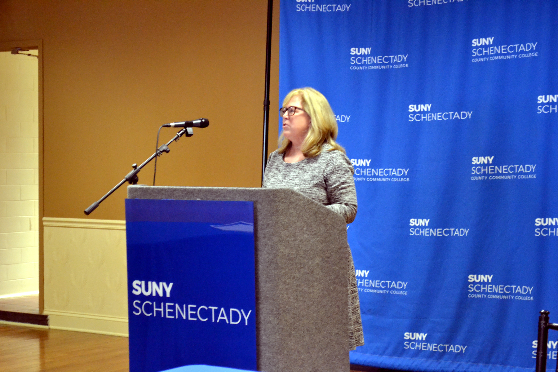 Patti Vitale speaking at podium