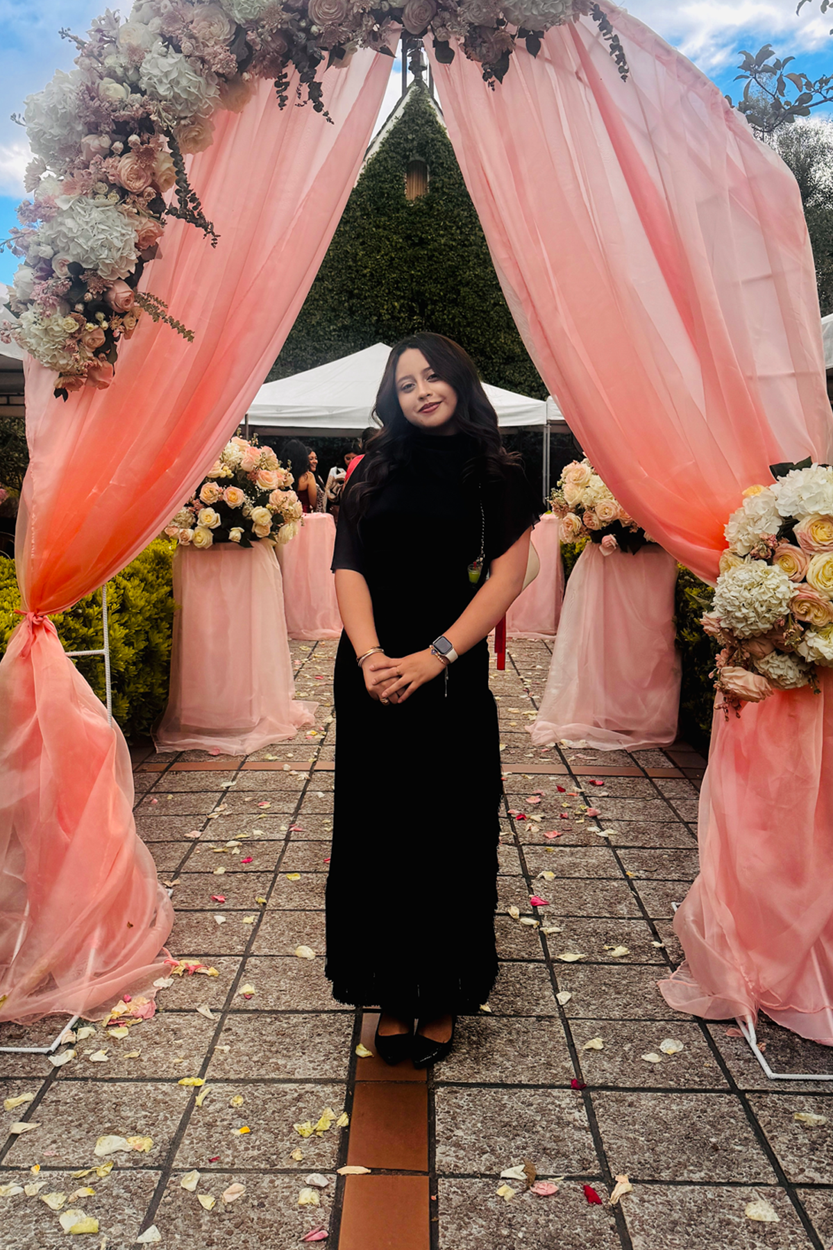 Camila Uvillús standing outside