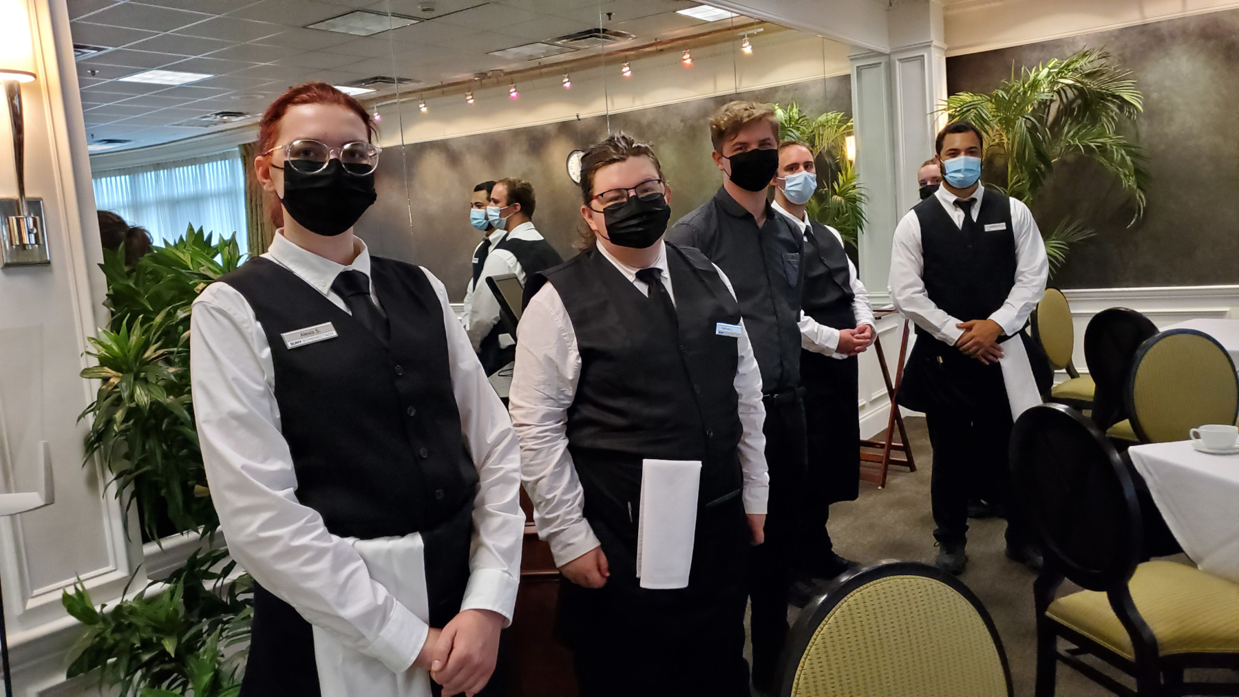 Students in uniform in line waiting for guests to arrive