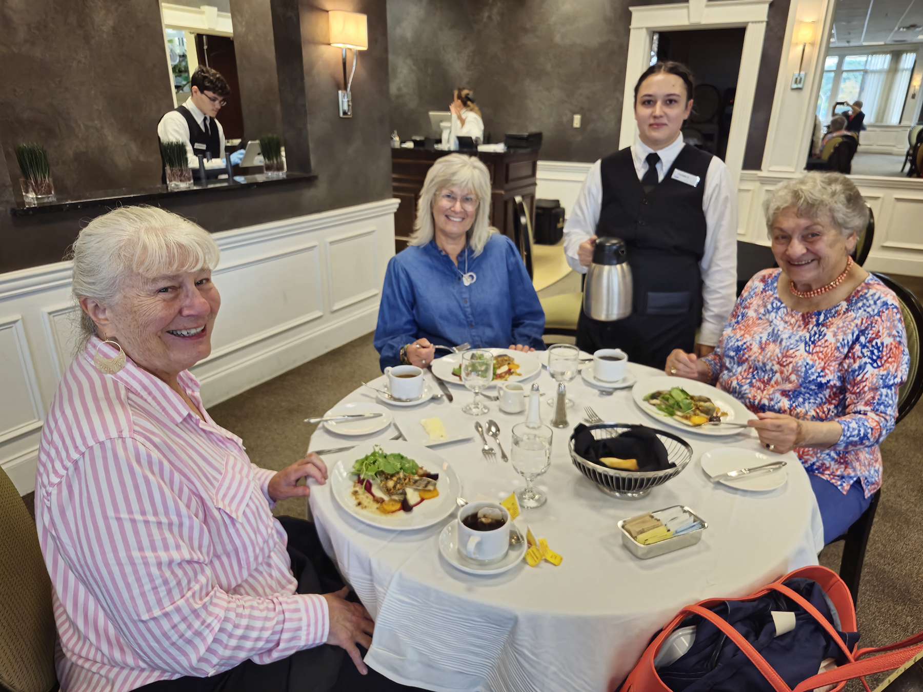 Guests and student server in the Casola Dining Room