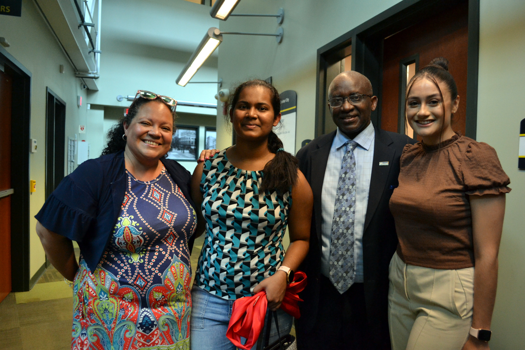 Dr. Moono, Pam McCall and students inside Center City