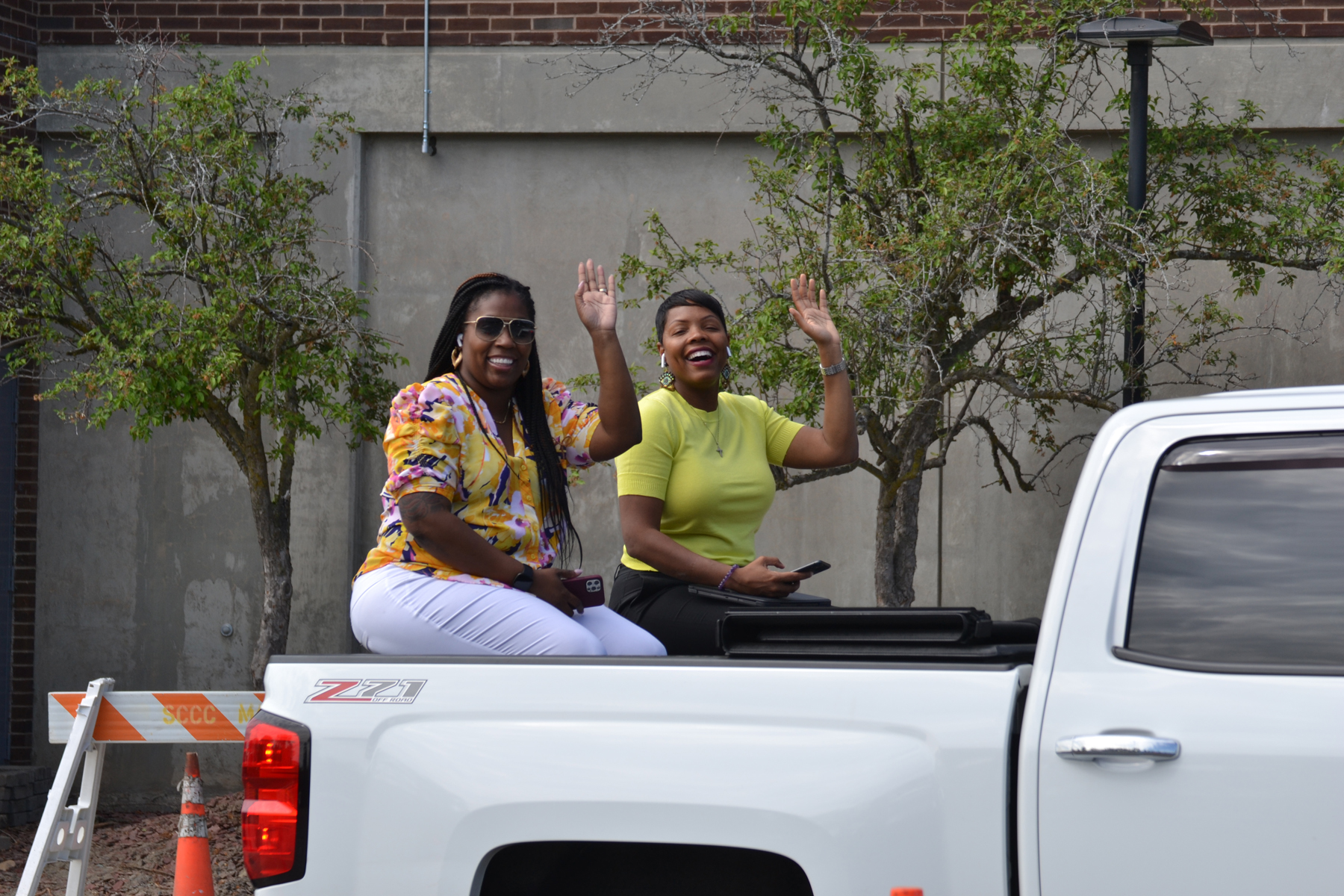 Family members cheering in truck