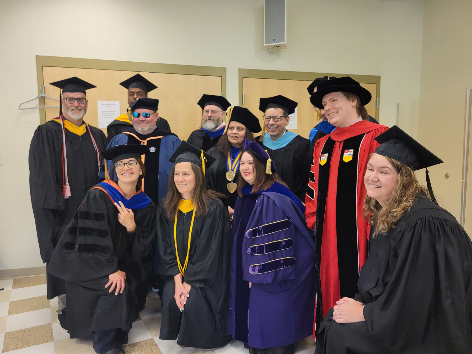 Faculty in group in School of Music, posing for photo