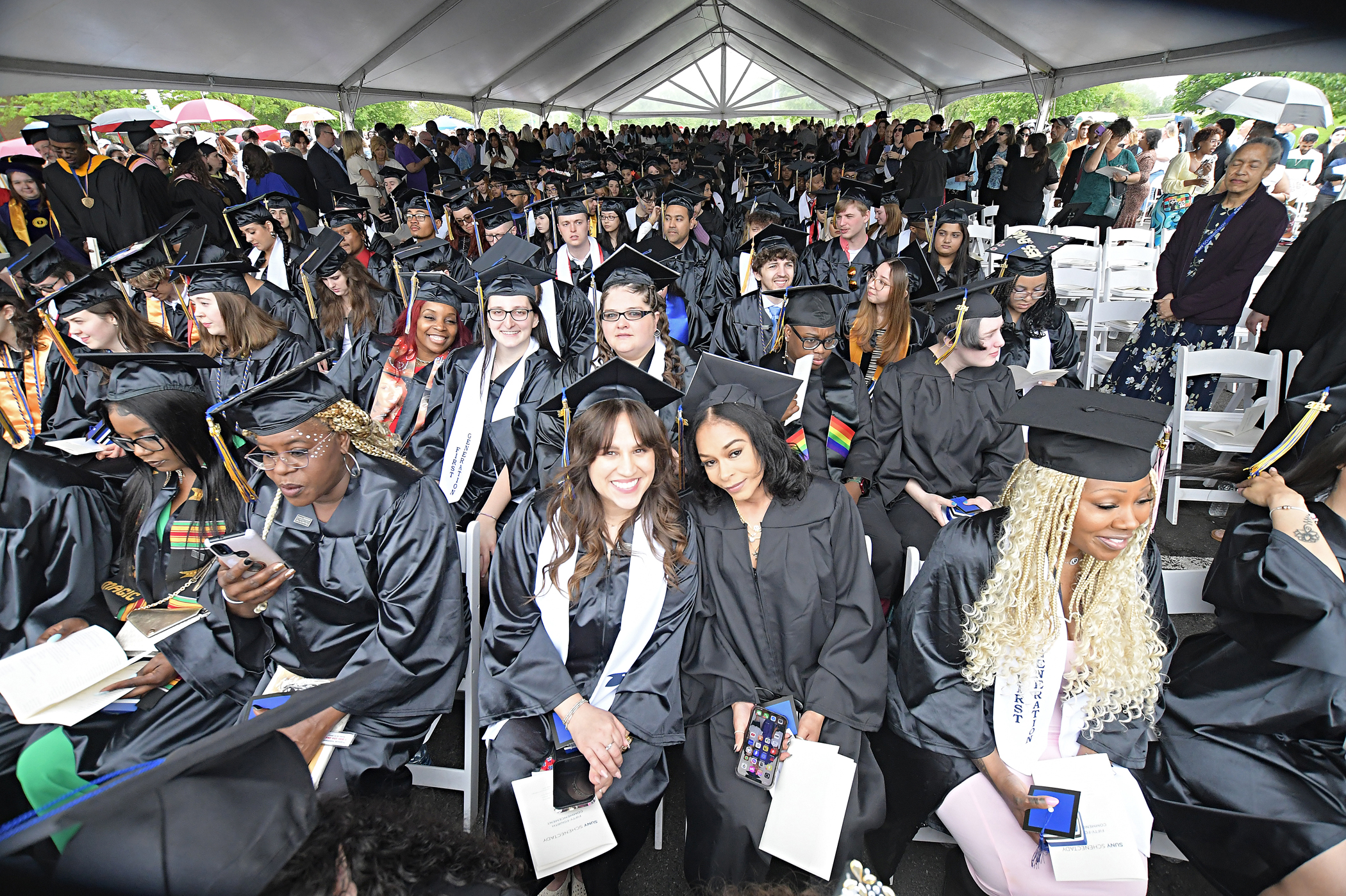 Graduates seated outside during Commencement ceremony