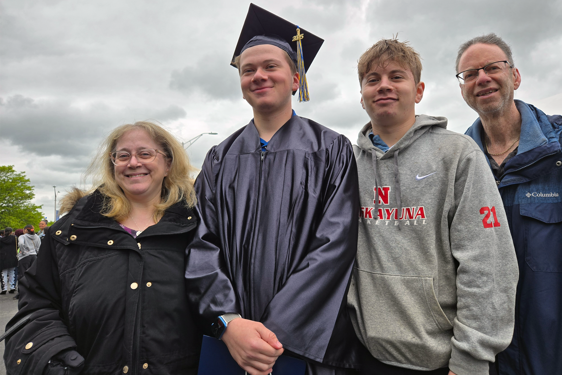 Graduate celebrating with family