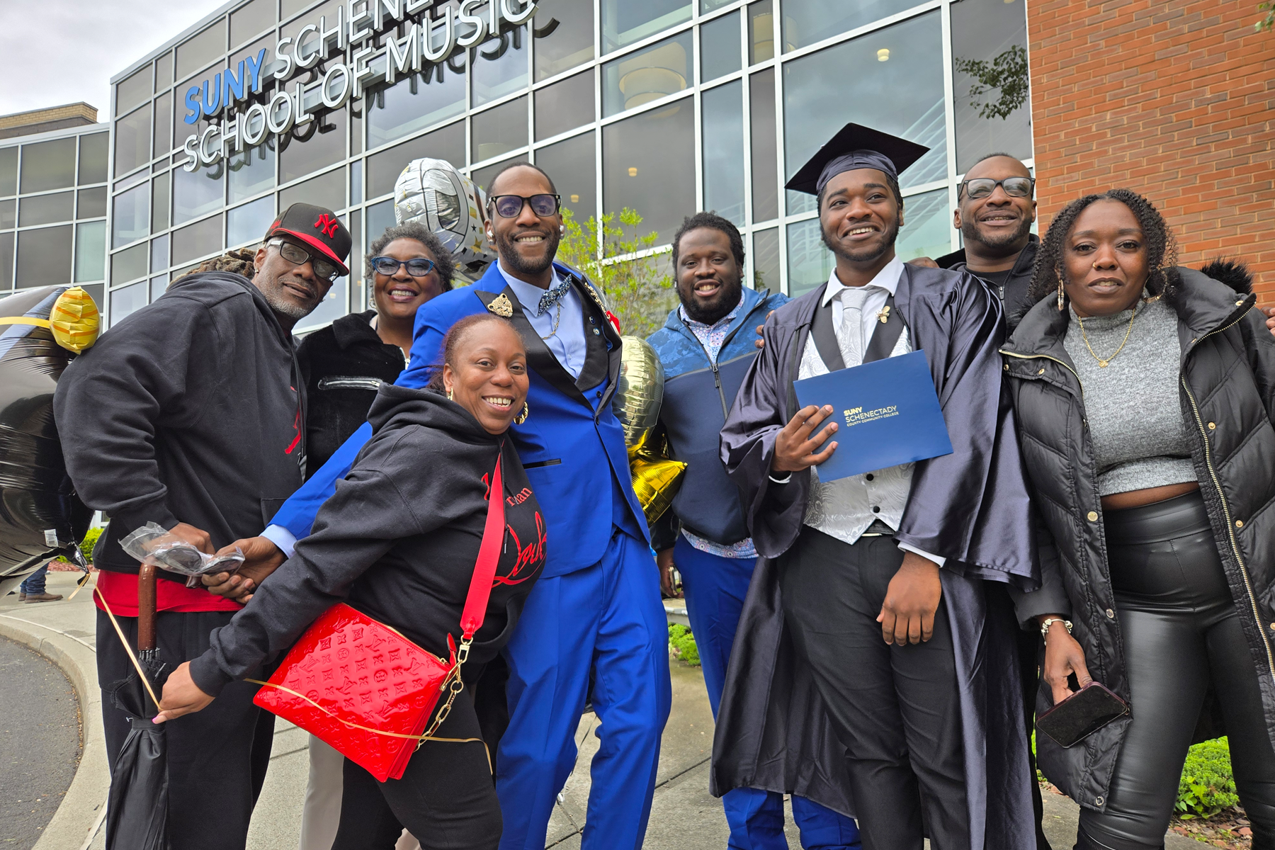 Graduate celebrating with family