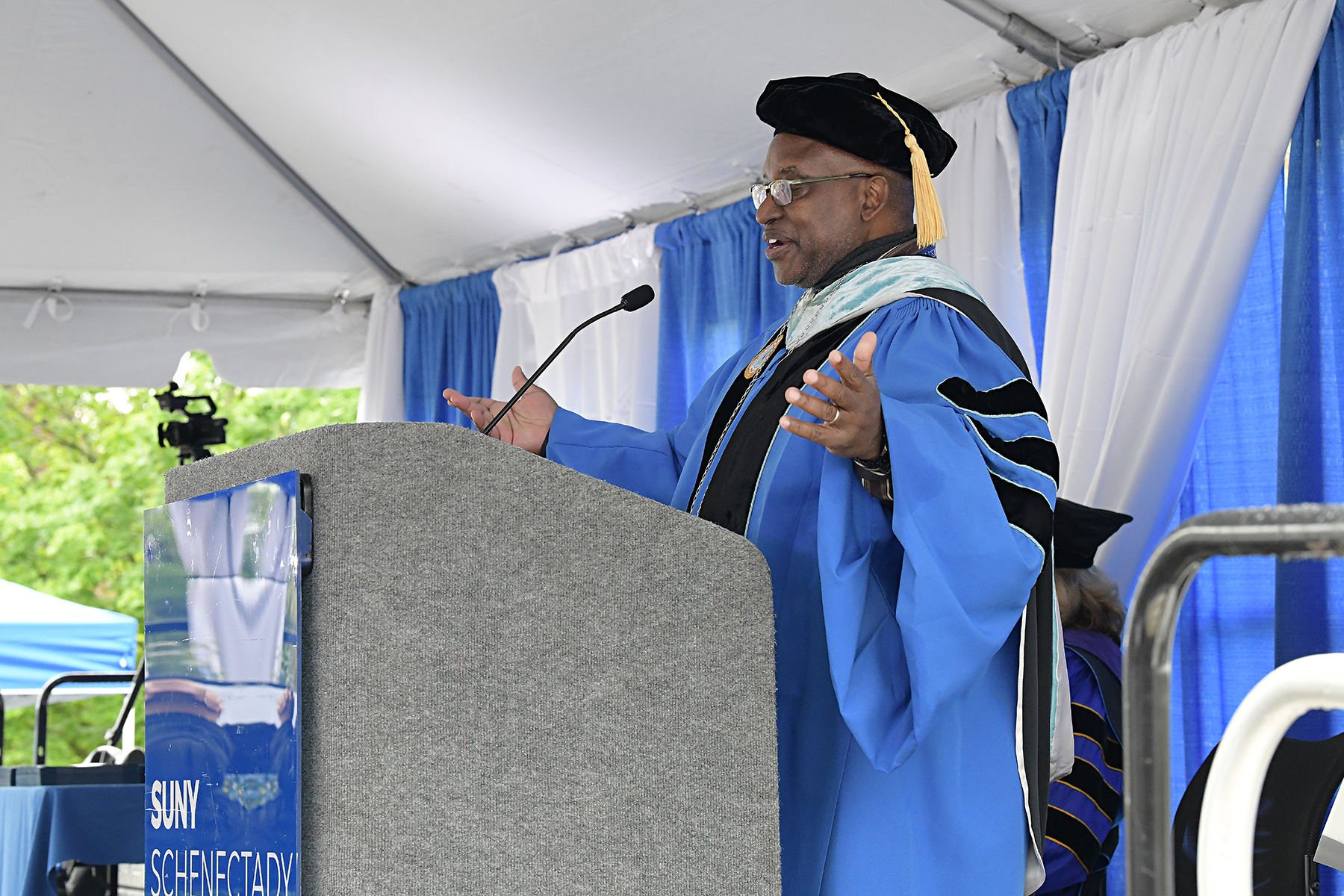 Dr. Moono speaking at podium