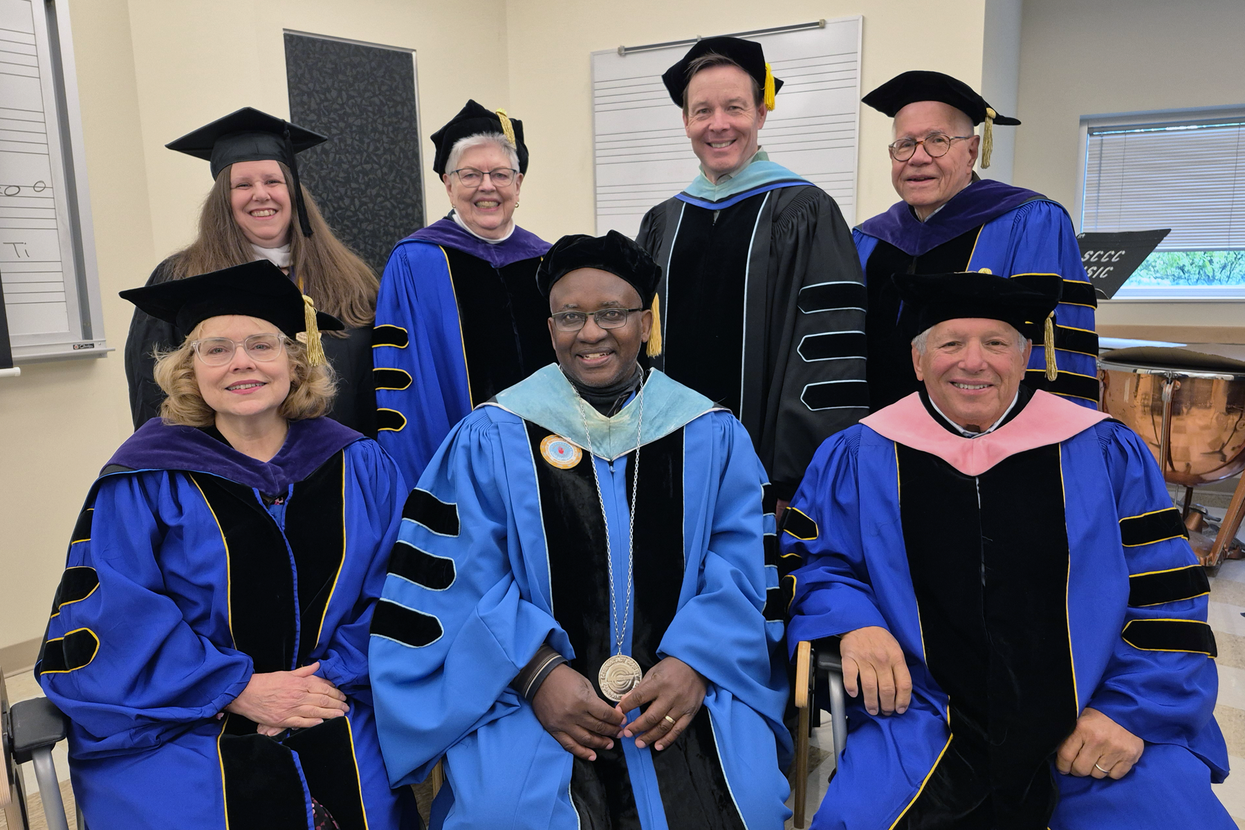Board of Trustees and Dr. Steady Moono, in cap and gown