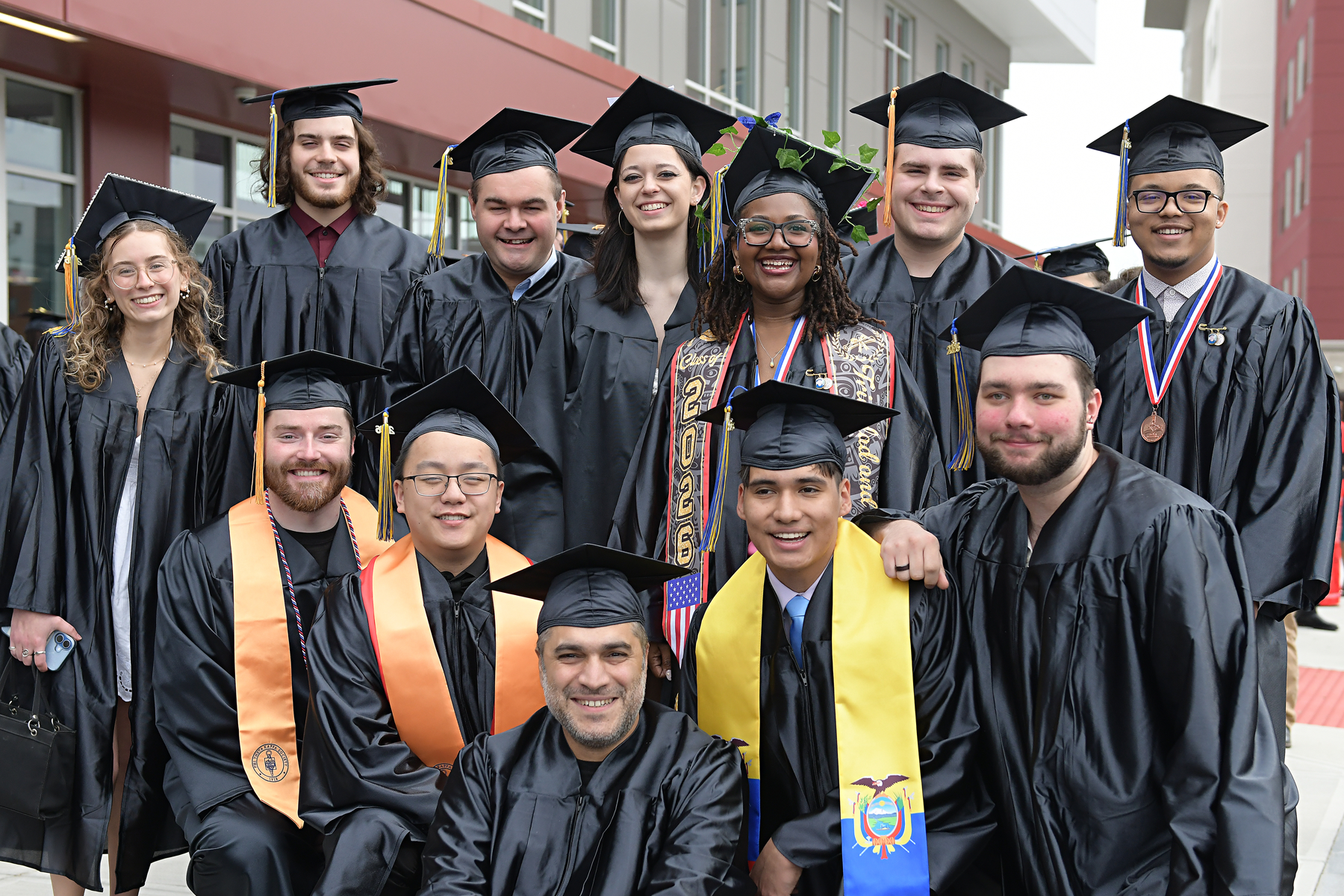 Students celebrating outside following Commencement 2026