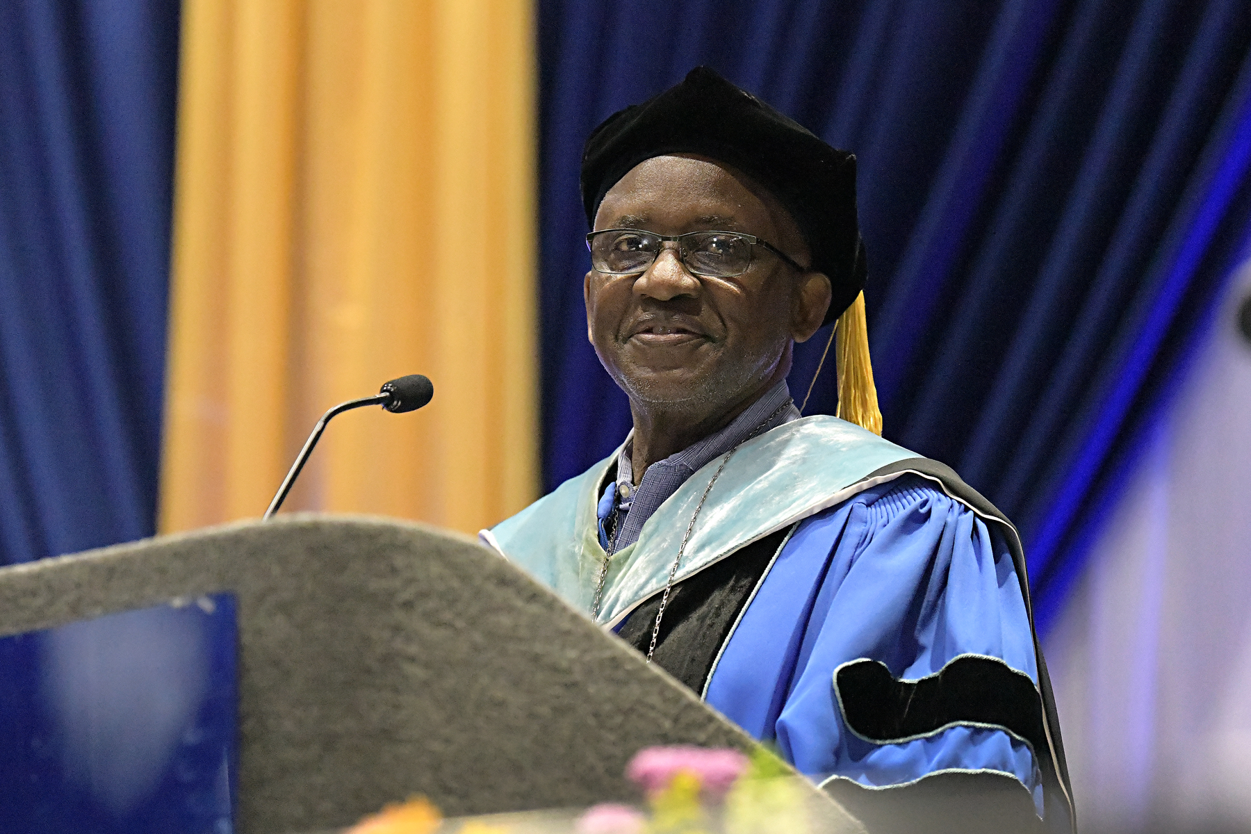 Dr. Steady Moono speaking at podium