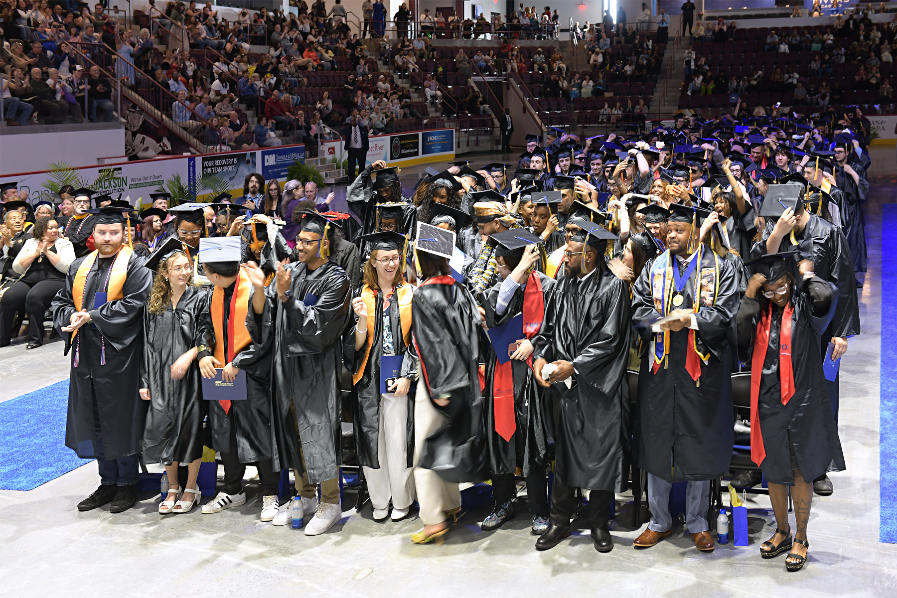 Graduates celebrating during Commencement 2026 inside the M&T Bank Center