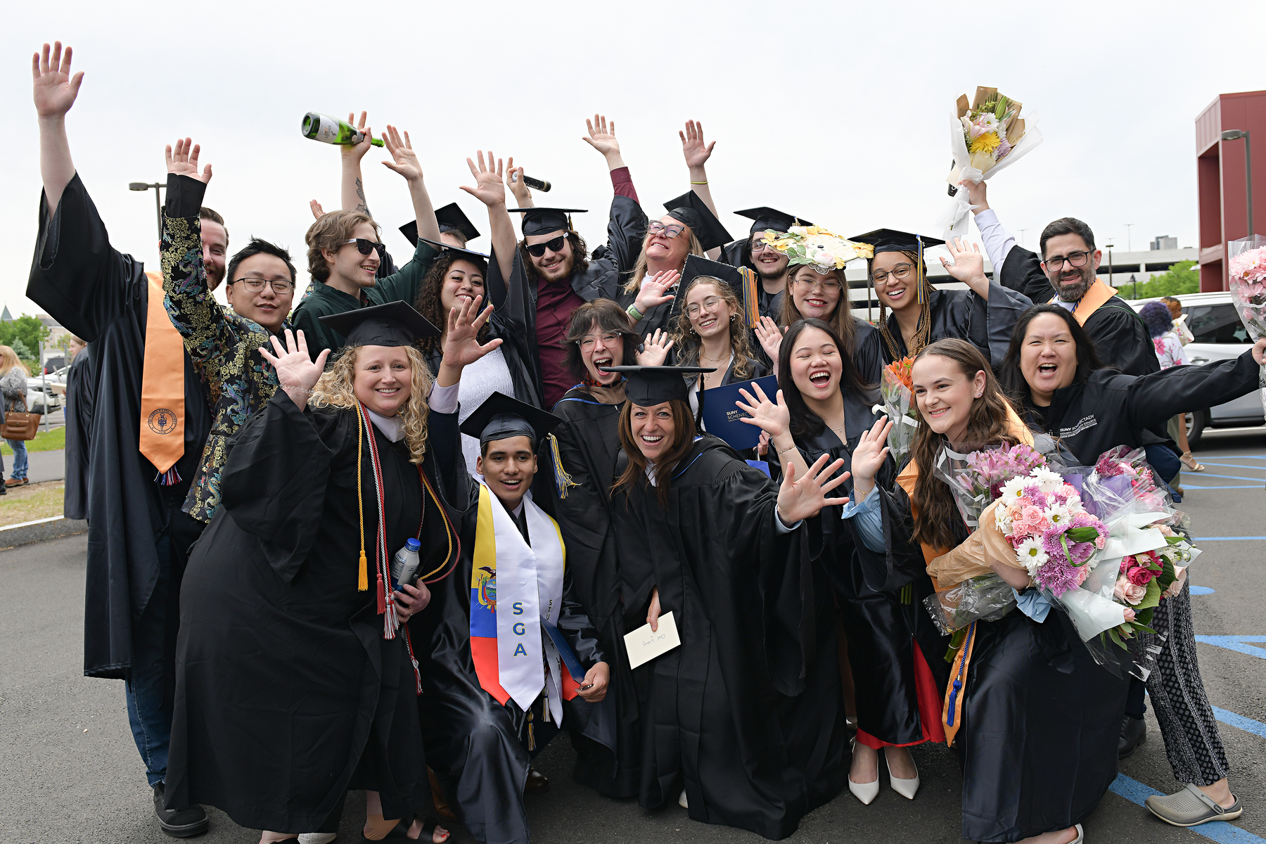 Students and faculty celebrating outside after Commencement 2026.