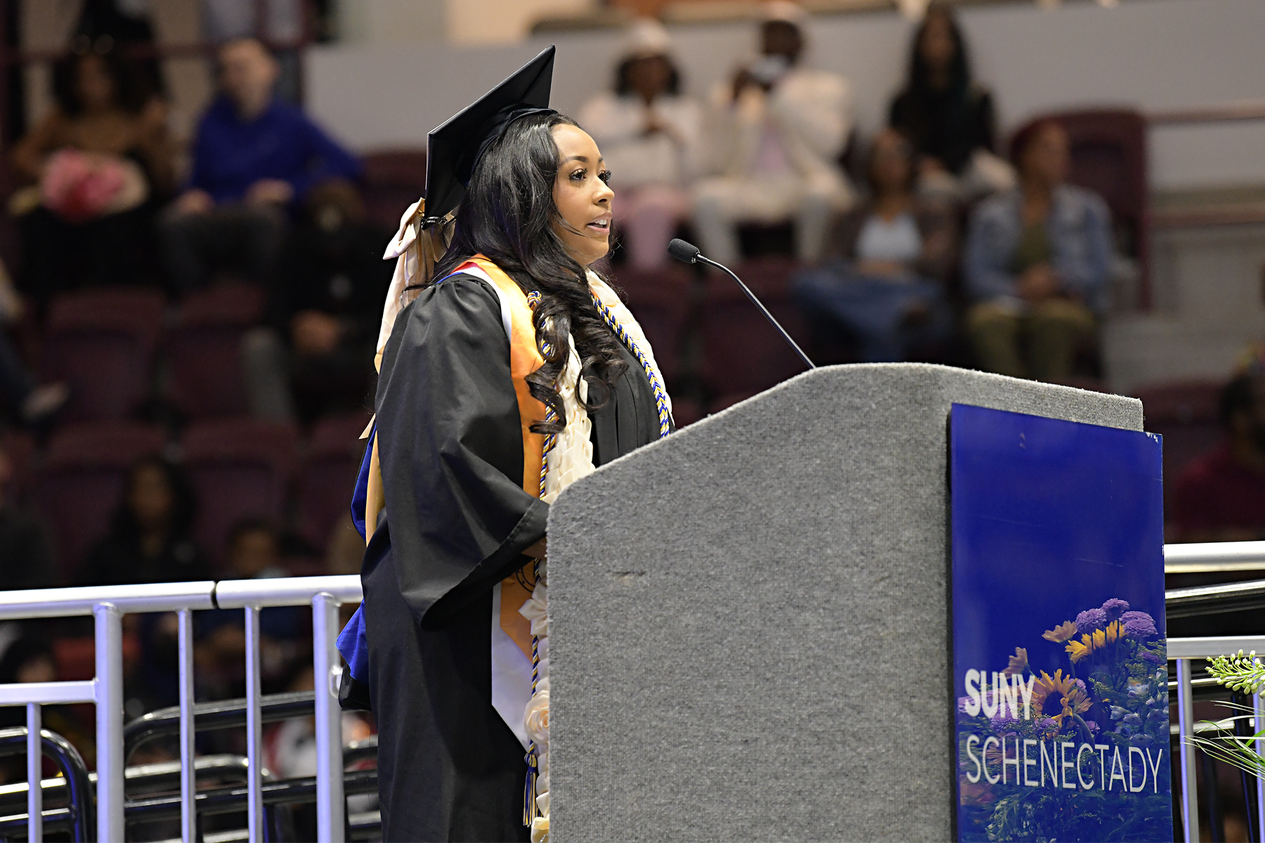 Nadine Davila on stage, speaking