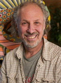 Headshot of Craig Petreikis, smiling