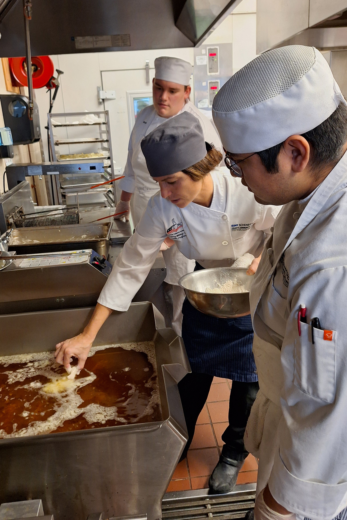 Chef Courtney Withey teaching students in Culinary Lab