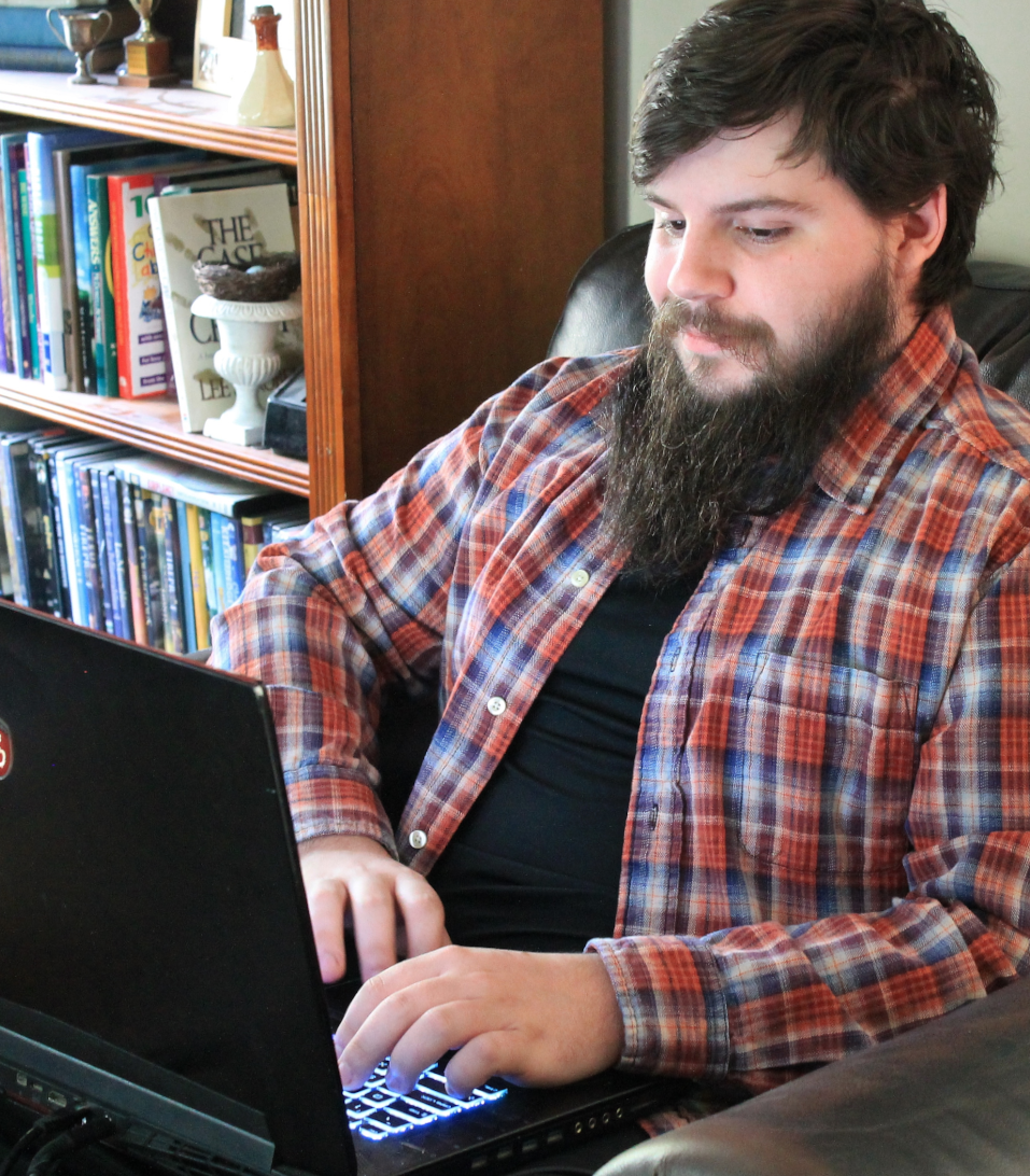 Daniel Petrillo at home, on his laptop. 
