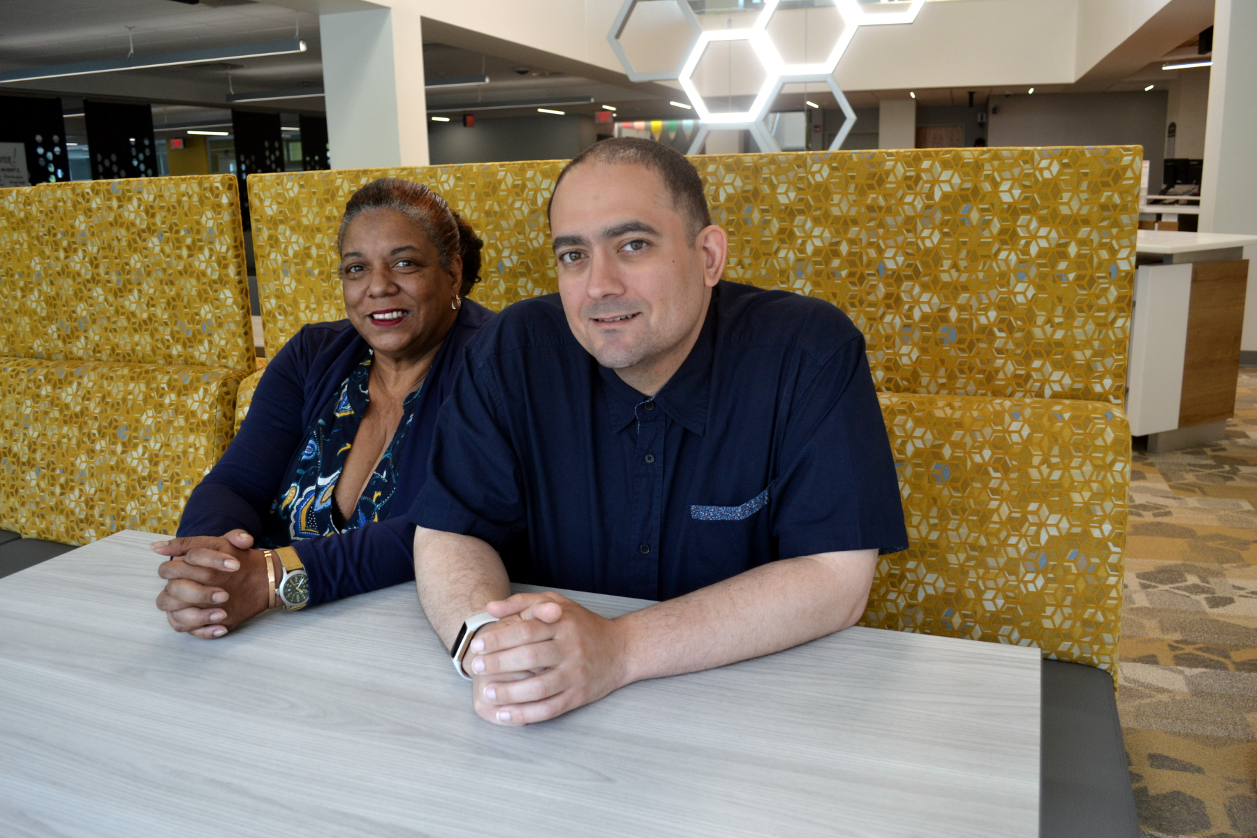 Davetta Simmons and Jason Gibson sitting in Learning Commons